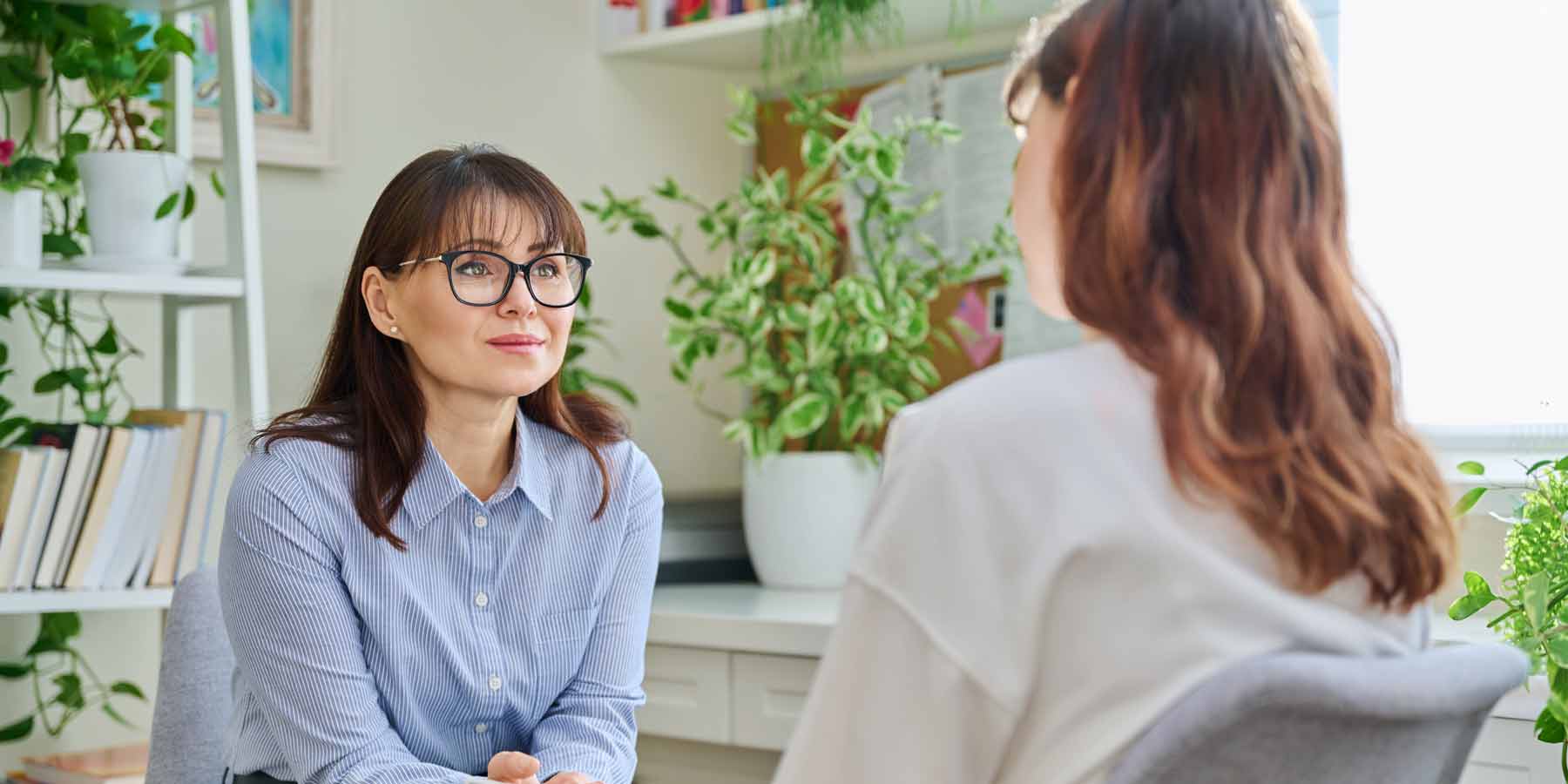 Woman counsellor with young woman